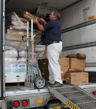 Matt Johnson, a district sales representative for Merchants Foodservice in Baton Rouge, Louisiana, unloads a pallet of charcoal at a Samaritan’s Purse shelter in Gonzales, Louisiana, on August 26. Johnson, along with thousands of other area residents, lost many of his possessions and saw flood damage to his home during the recent flooding in south Louisiana. The foodservice distributor and more than 30 of its vendor partners donated food and other supplies to the relief effort.